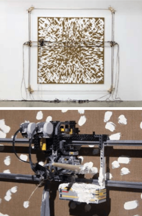 A mechanical device painting a picture.