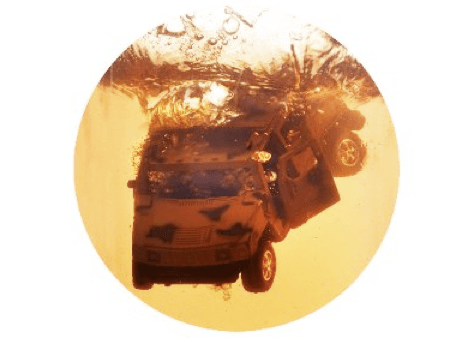 A car sinking under water.