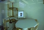 A computer on a desk.