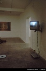 A television screen mounted on a wall.