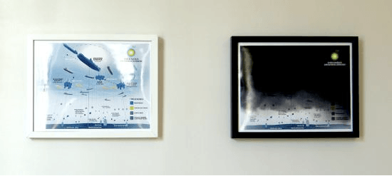 Two picture frames hanging on a wall.